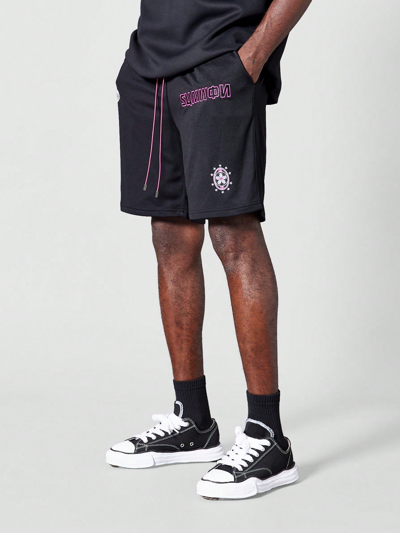 Mesh Shorts With Front Graphic And Badges