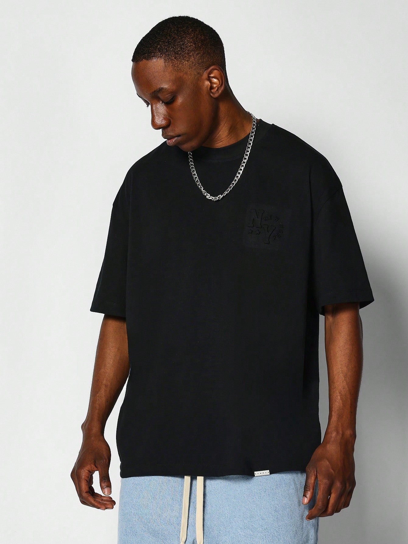 Oversized Crew Neck Tee With Front And Back Embossed Graphic Print