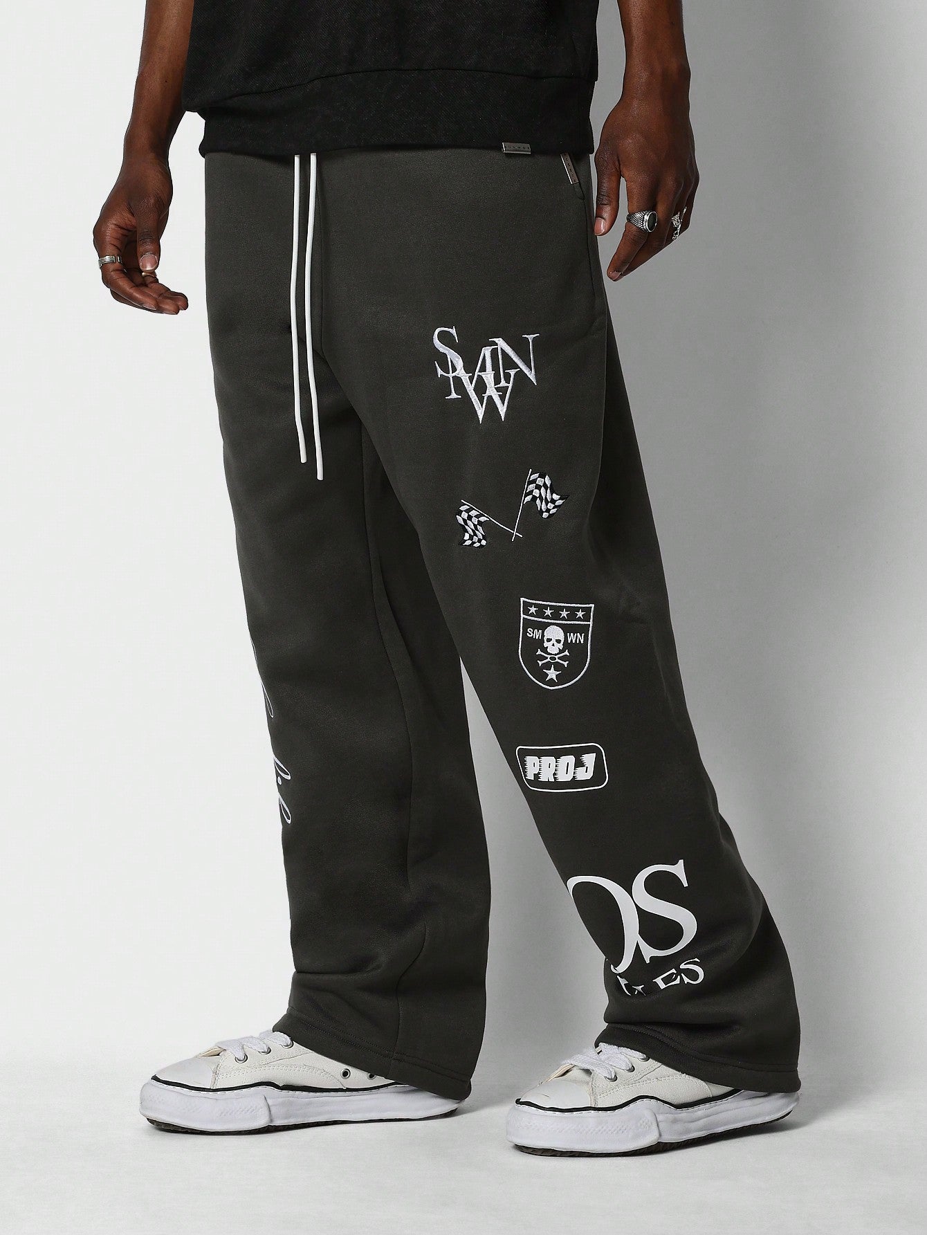 Loose Fit Baggy Drop Crotch Jogger Pants With Multi Patch Graphic