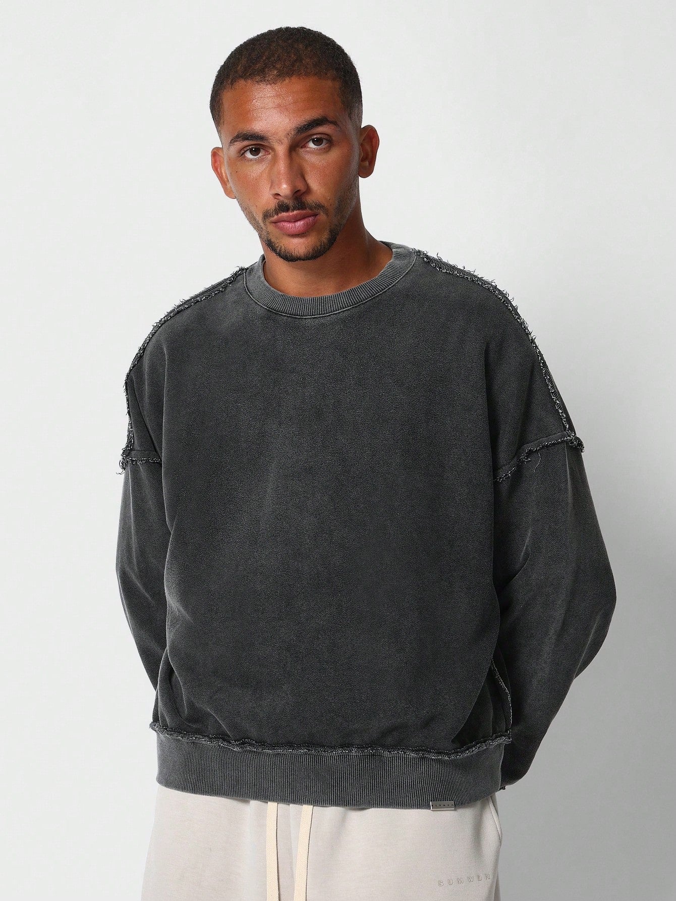 Oversized Fit Crew Neck Sweatshirt With Raw Seam Detail