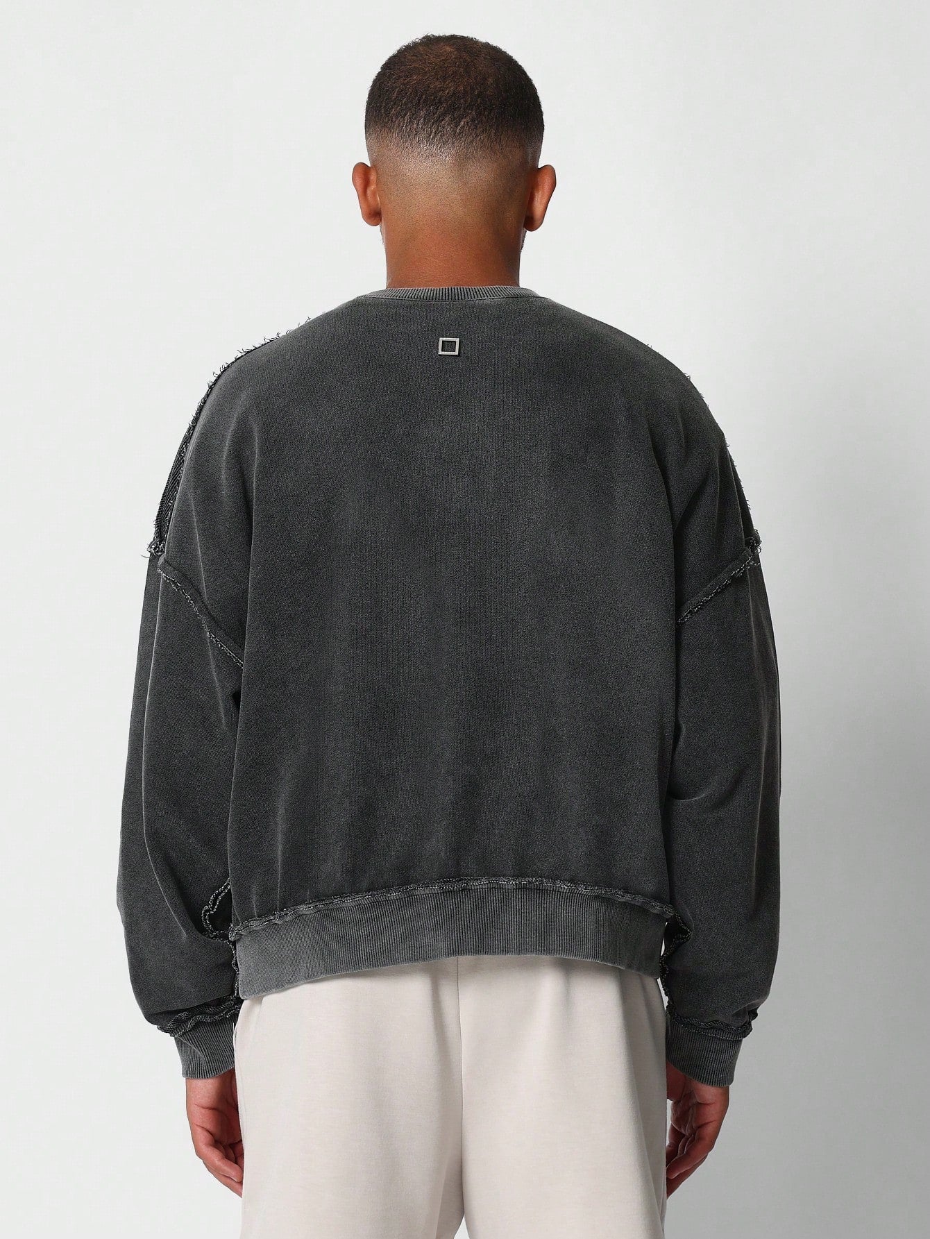 Oversized Fit Crew Neck Sweatshirt With Raw Seam Detail