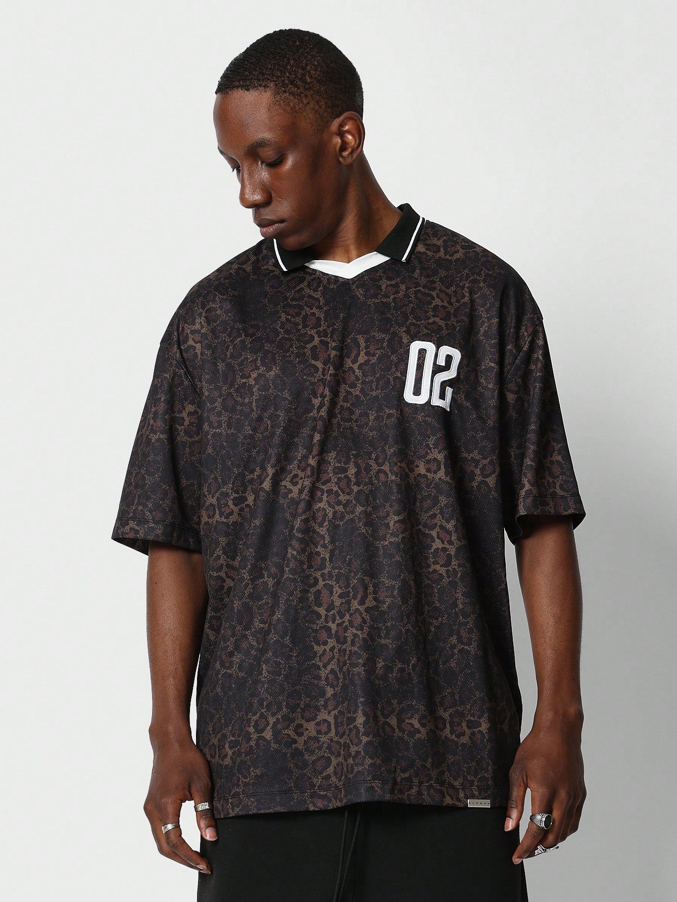 Oversized Fit Football Tee With All Over Leopard And Number Graphic Print