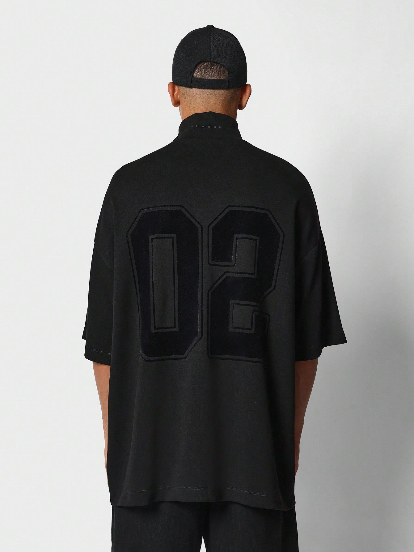 Oversized Fit Mock Neck Half Zip Tee With Number 2 Graphic Print