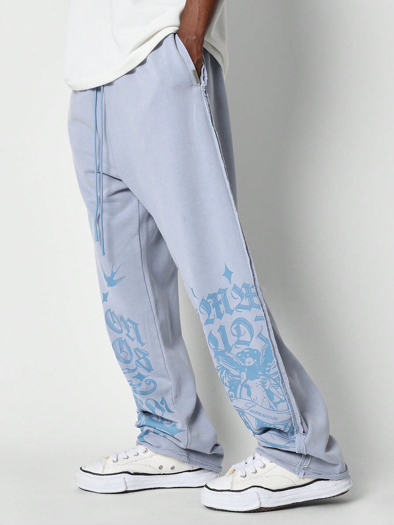 Drop Crotch Raw Edge Jogger With Exposed Seam & Graphic Print