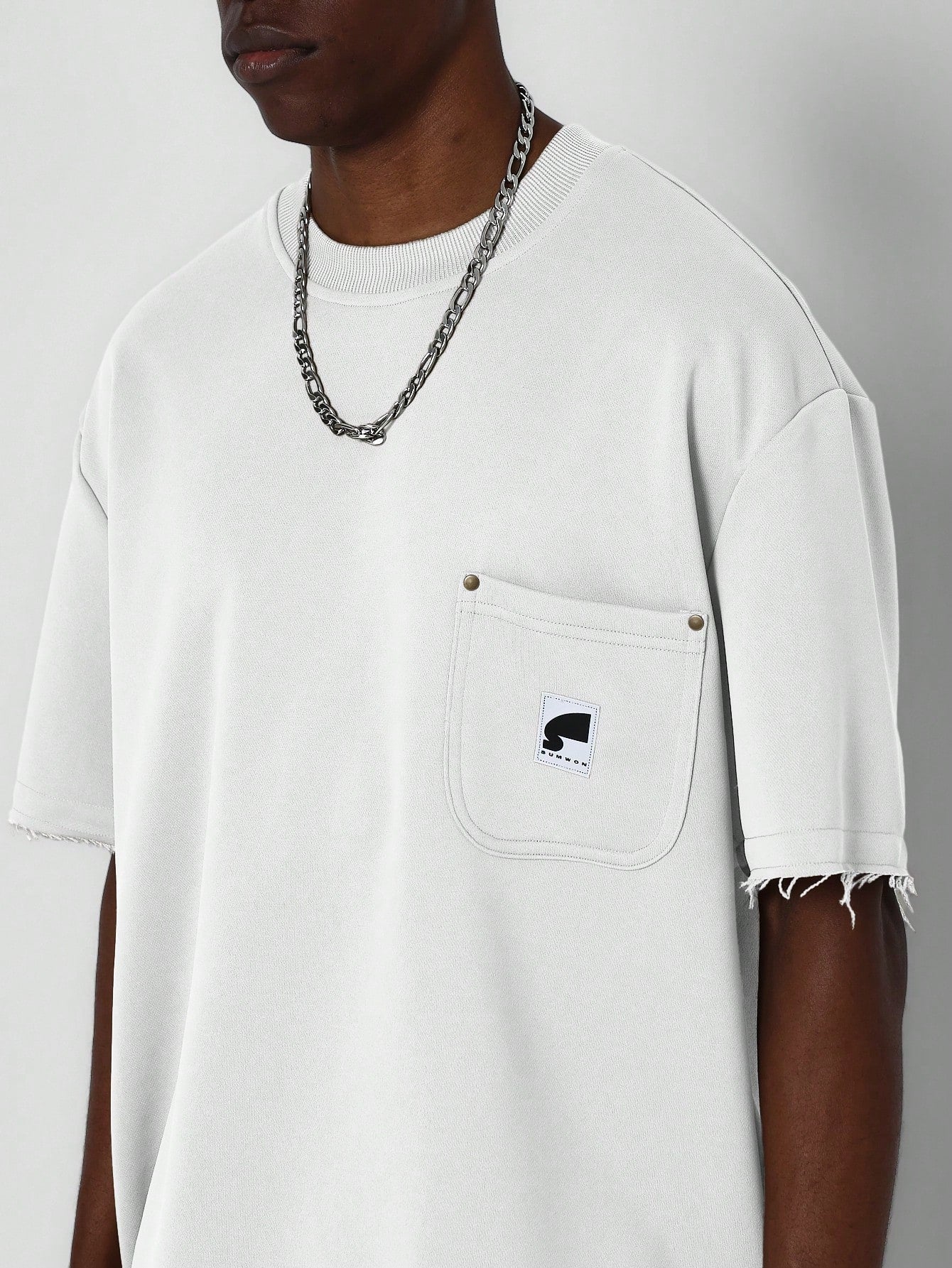 Tee With Patch Pocket And Raw Hem Detail