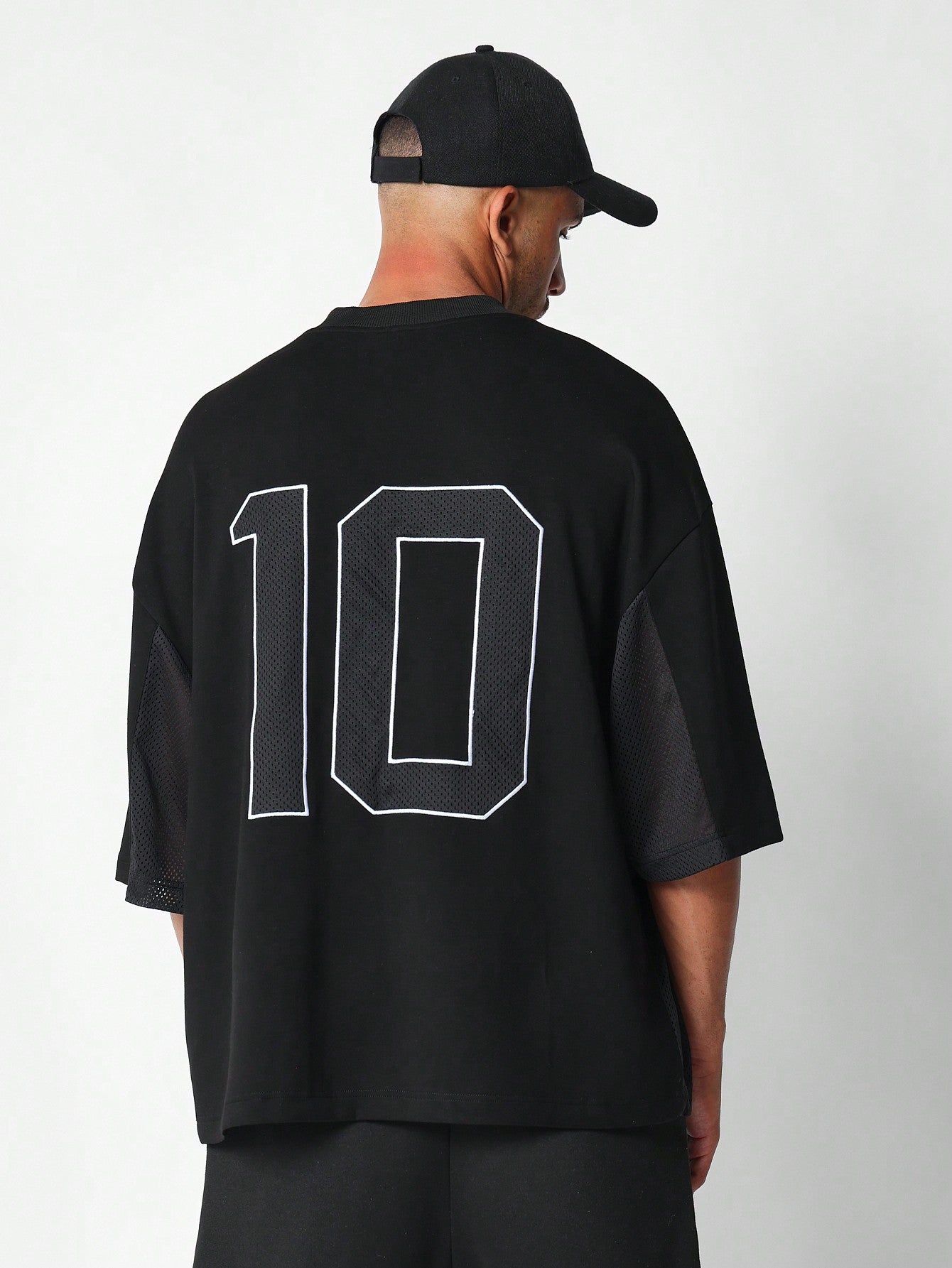 Oversized Fit Multi Panel Mesh Tee With Front Graphic Print & Back Mesh Number Applique