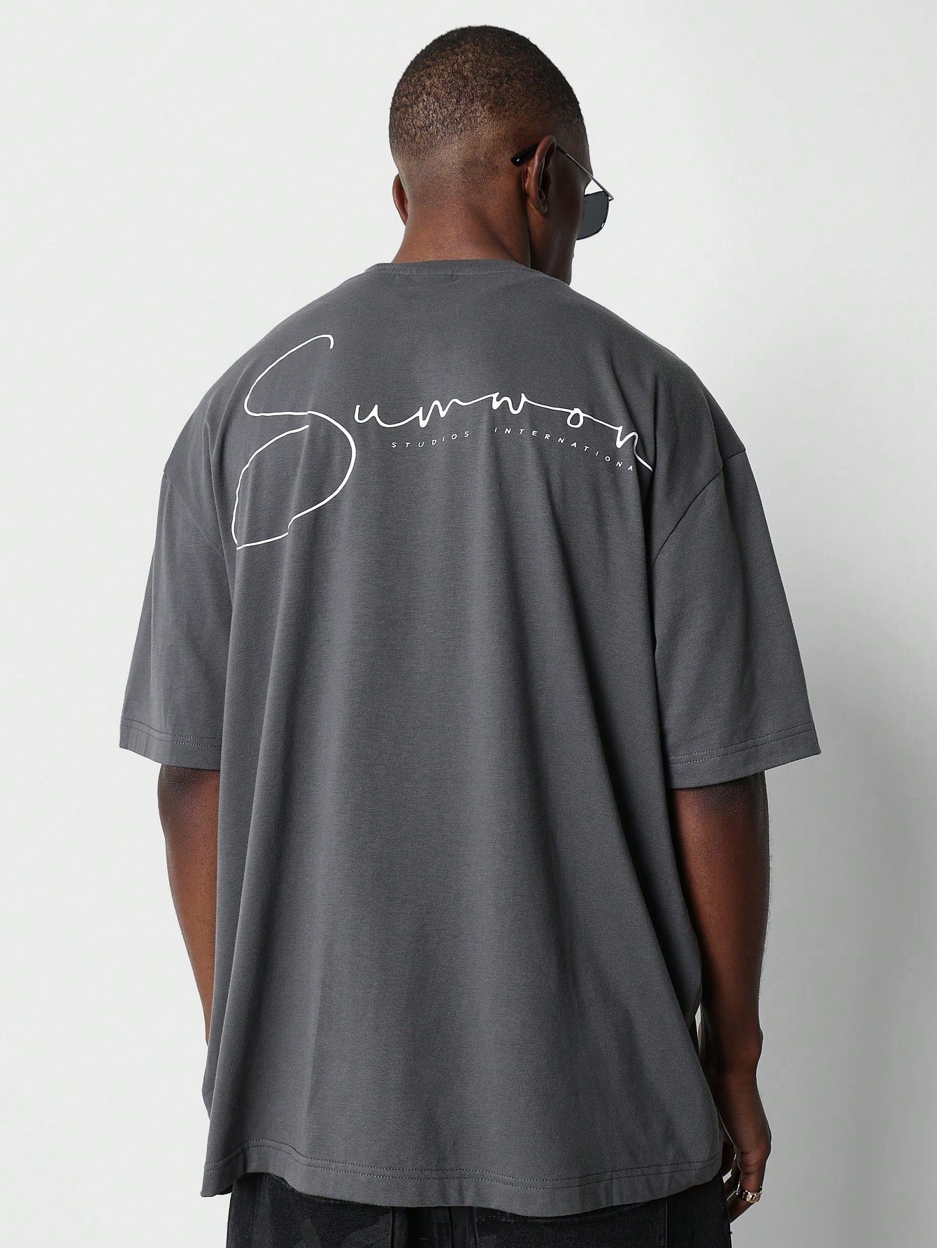 Oversized Fit Tee With Neck Print And Back Signature  Print