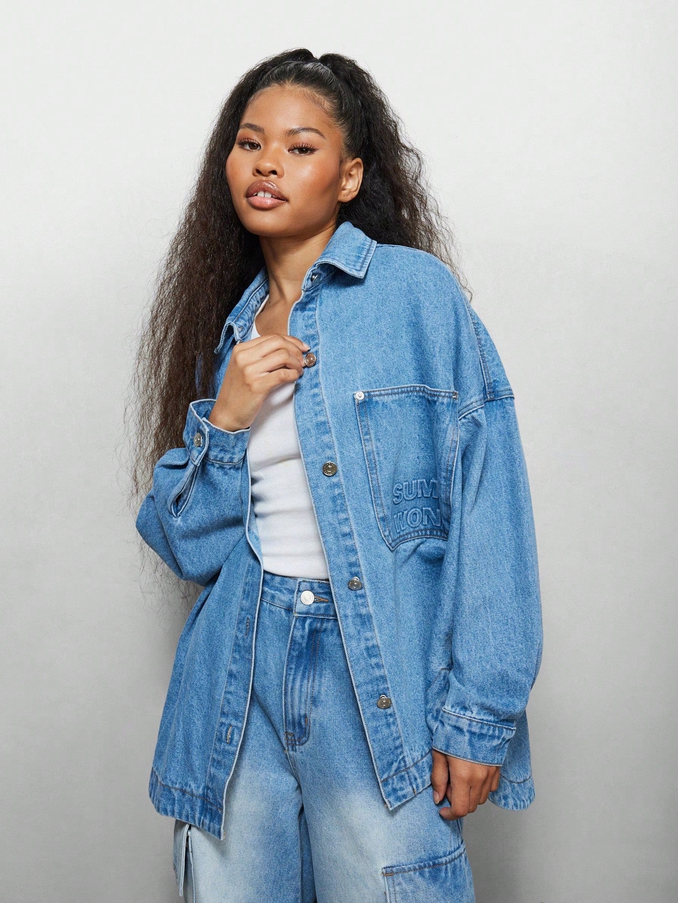 SUMWON WOMEN Oversized Denim Curve Hem Shirt With Front Pocket Emboss Print