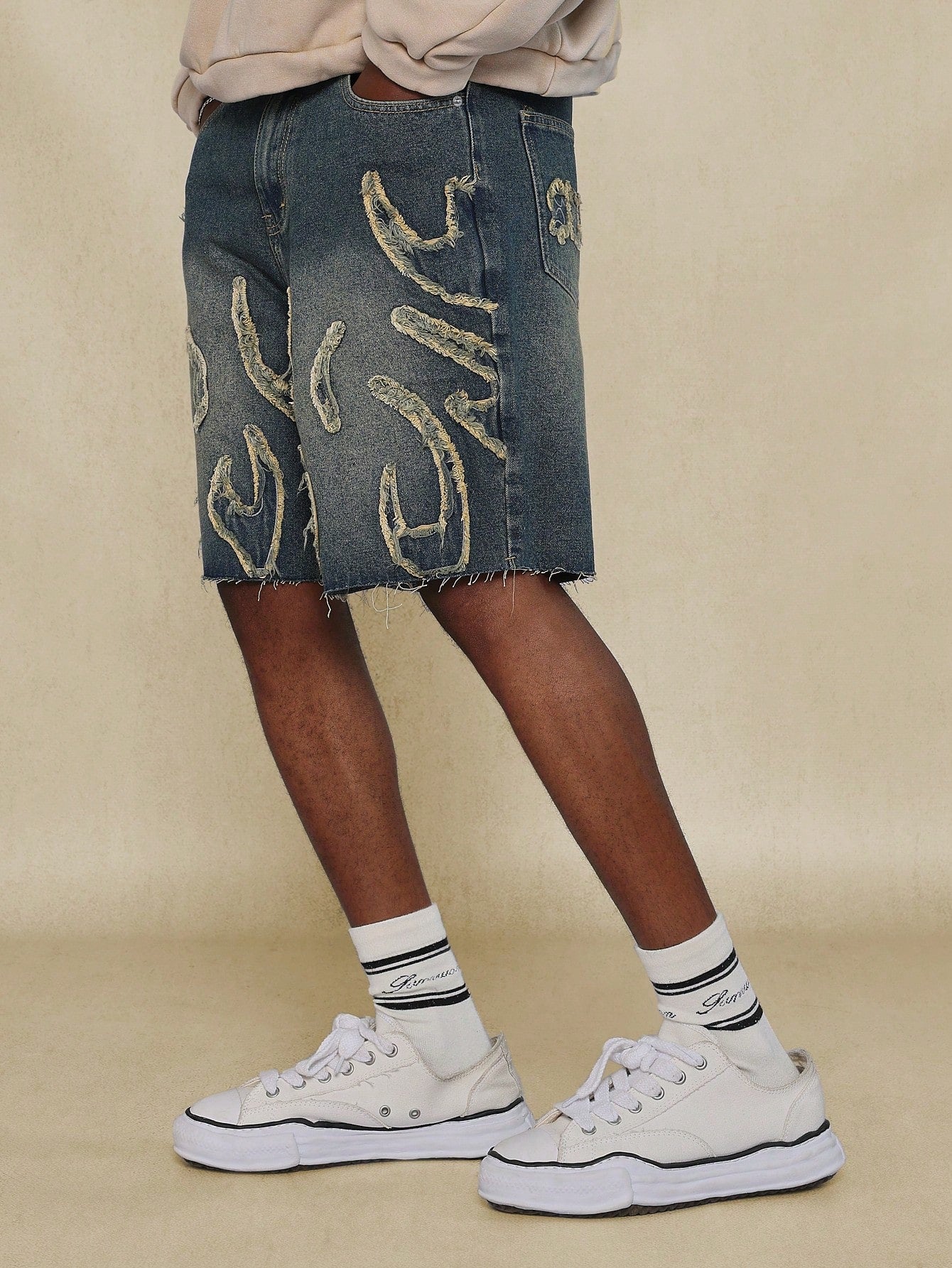 Washed Raw Edge Denim Short With All Over Raw Edge Applique