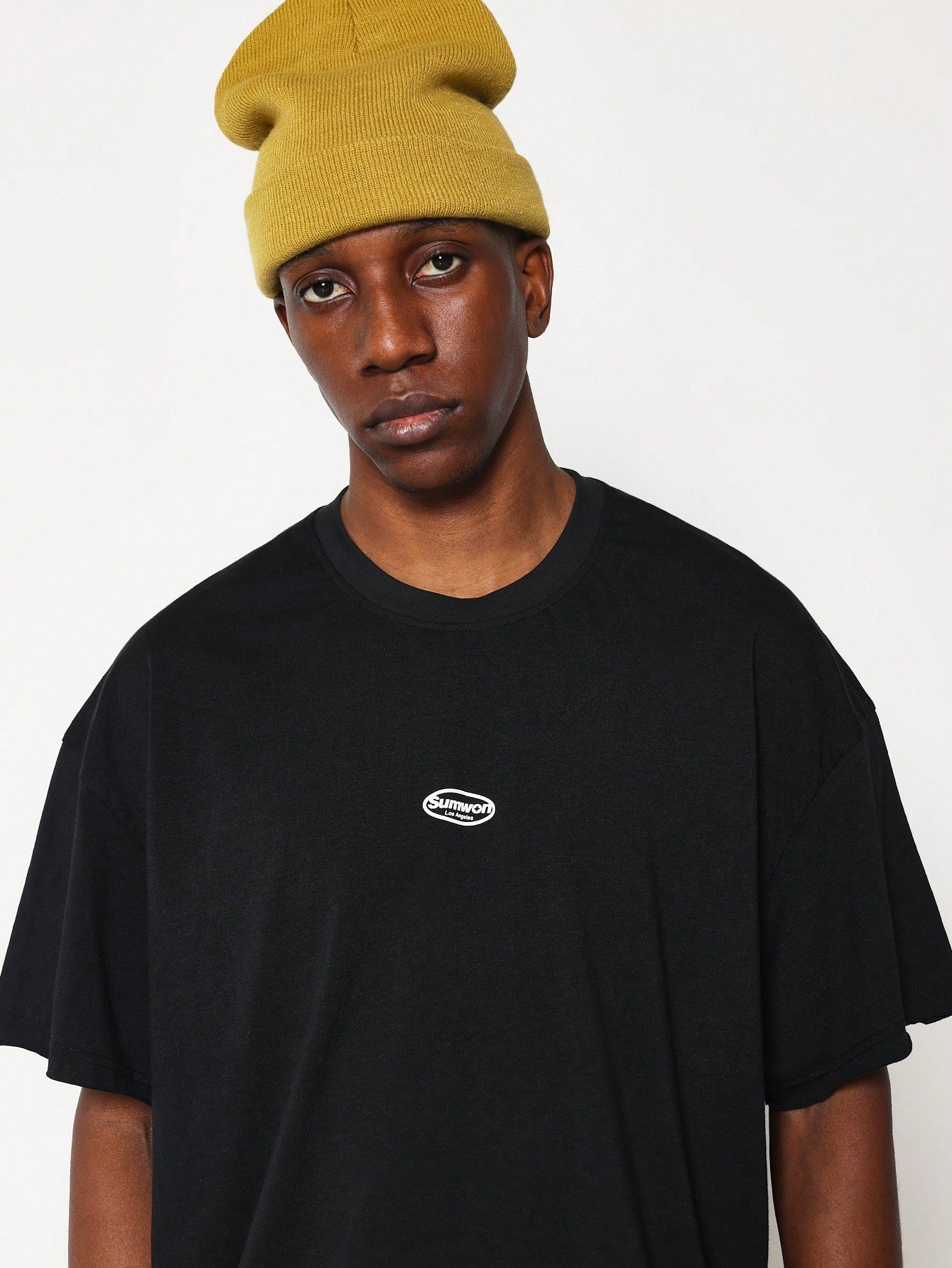 Boxy Raw Edge Cap Sleeve Tee With Small Graphic Print