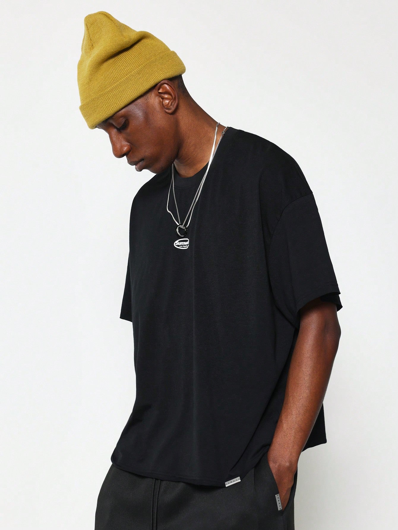 Boxy Raw Edge Cap Sleeve Tee With Small Graphic Print