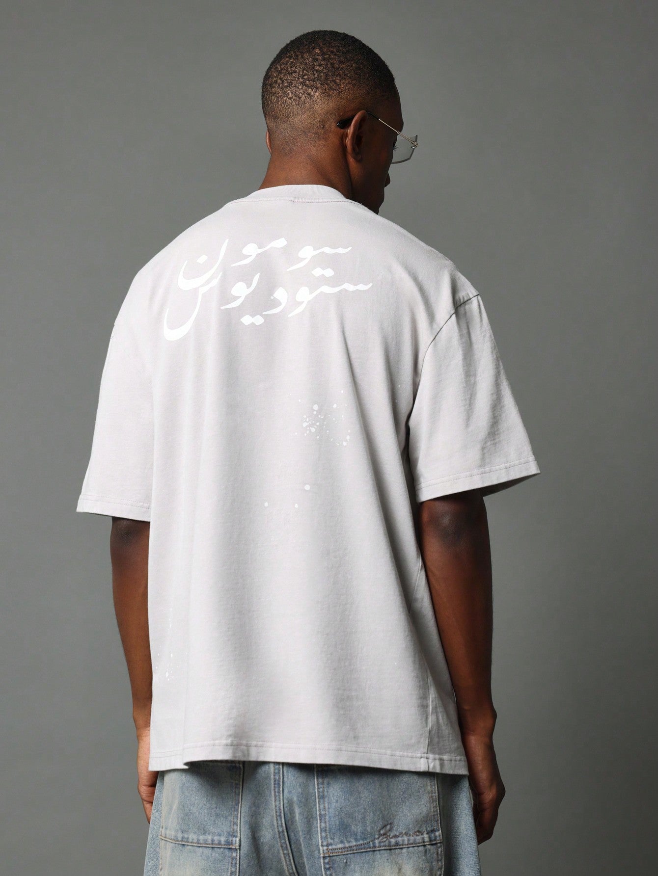 Regular Fit Short Sleeve Washed Tee With Splatter Paint & Arabic Graphic Print At The Back