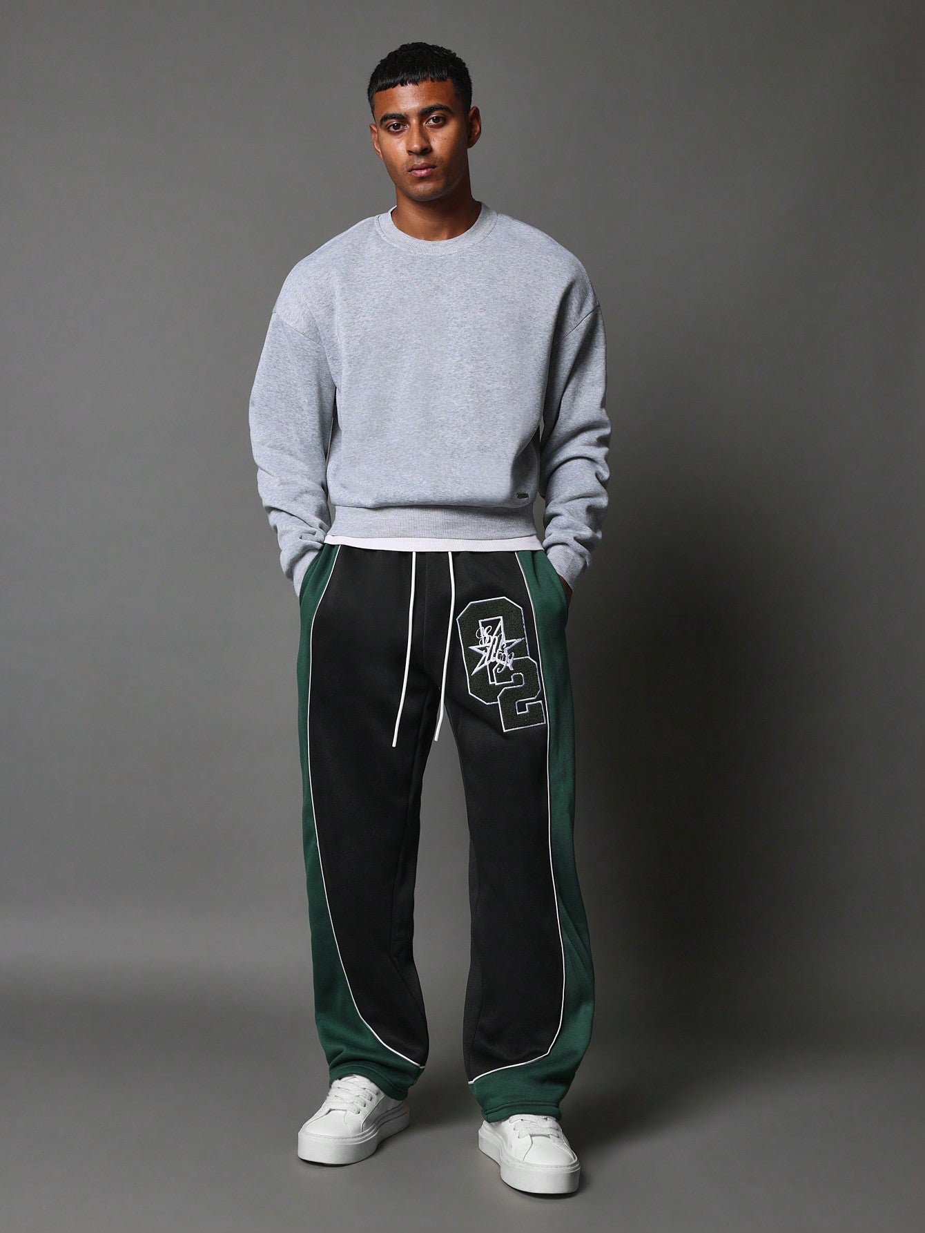 Wide Fit Drop Crotch Contrast Panel Sweatpants With Piping & Applique Badge Towelling