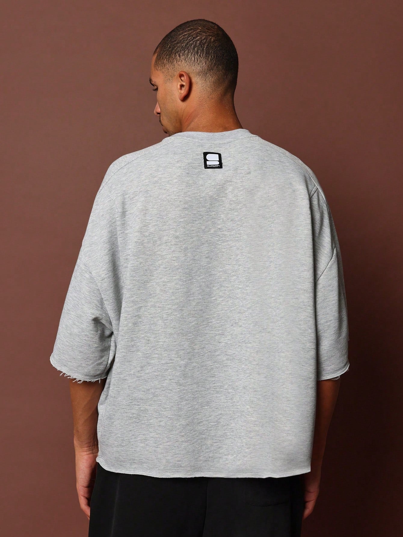 Boxy Fit Raw Edge Panel Elbow Sleeve Tee