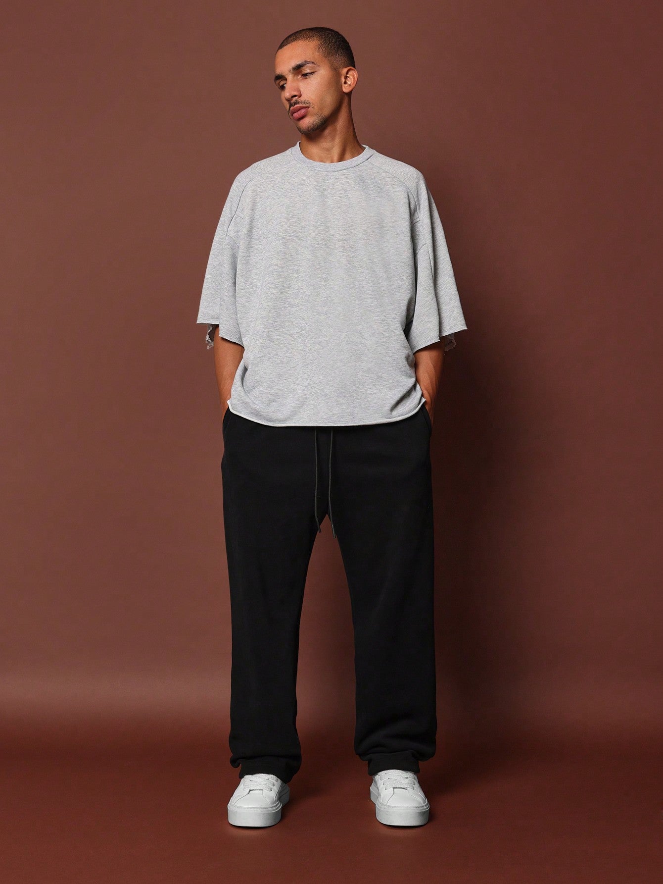 Boxy Fit Raw Edge Panel Elbow Sleeve Tee