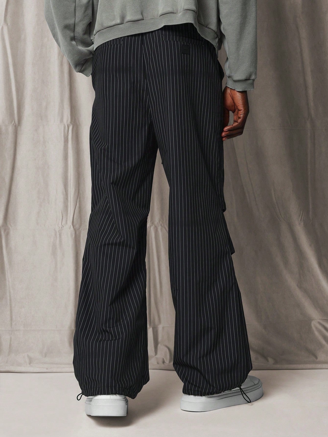 Loose Flare Fit Pinstripe Pant With Knee Pleats