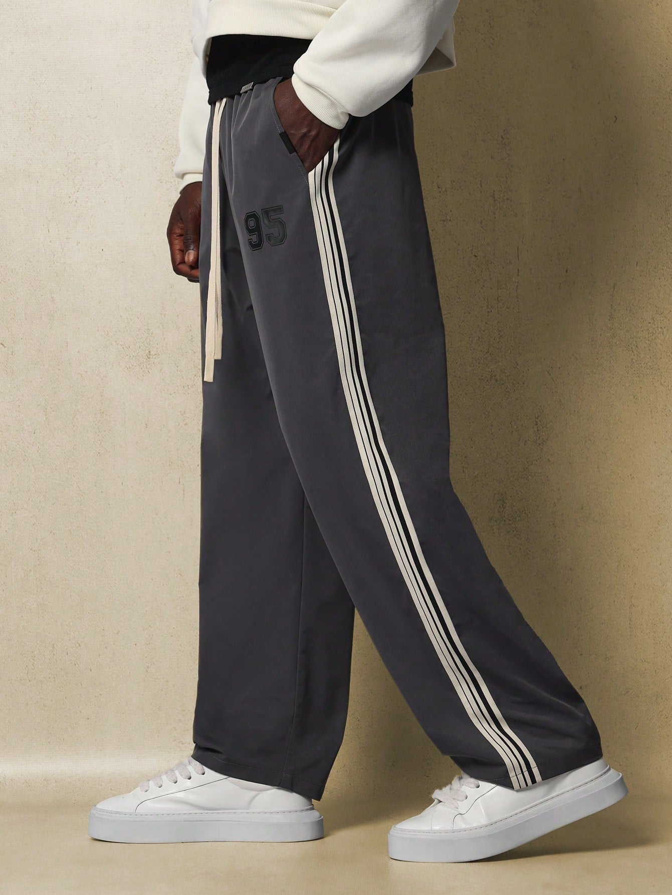 Pull On Straight Fit Drop Crotch Nylon Pant With Number Graphic Print And Tape