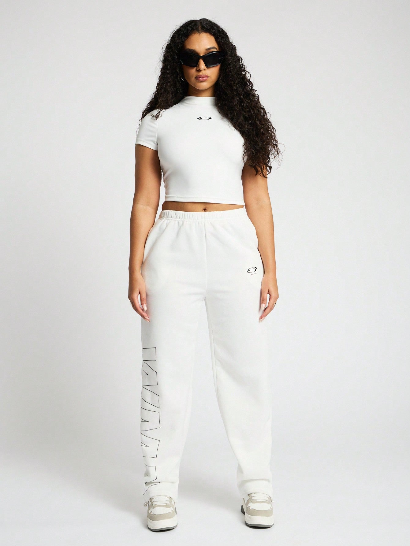 SUMWON WOMEN High Neck Crop Top And Straight Leg Jogger Co Ord With Graphic Print