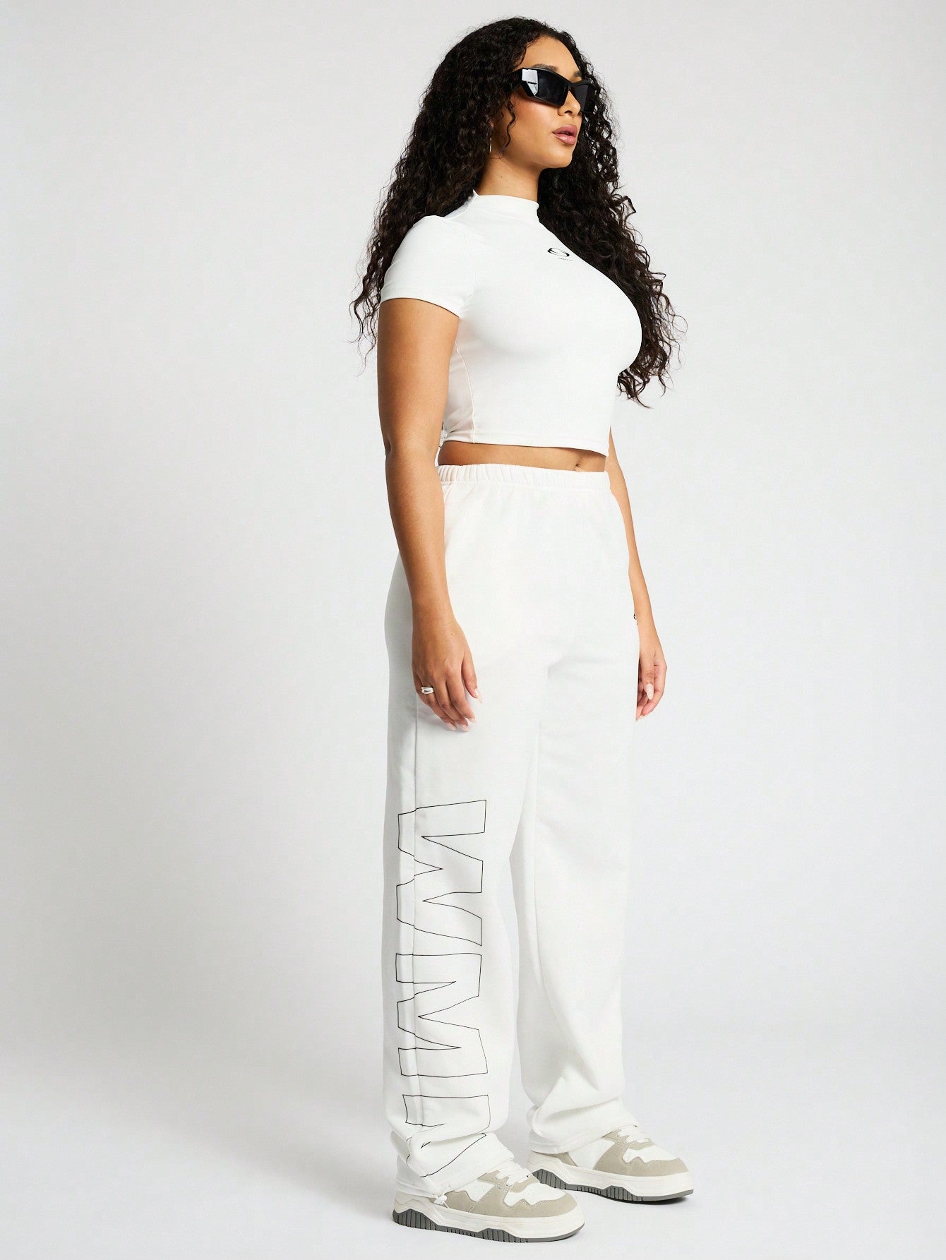 SUMWON WOMEN High Neck Crop Top And Straight Leg Jogger Co Ord With Graphic Print