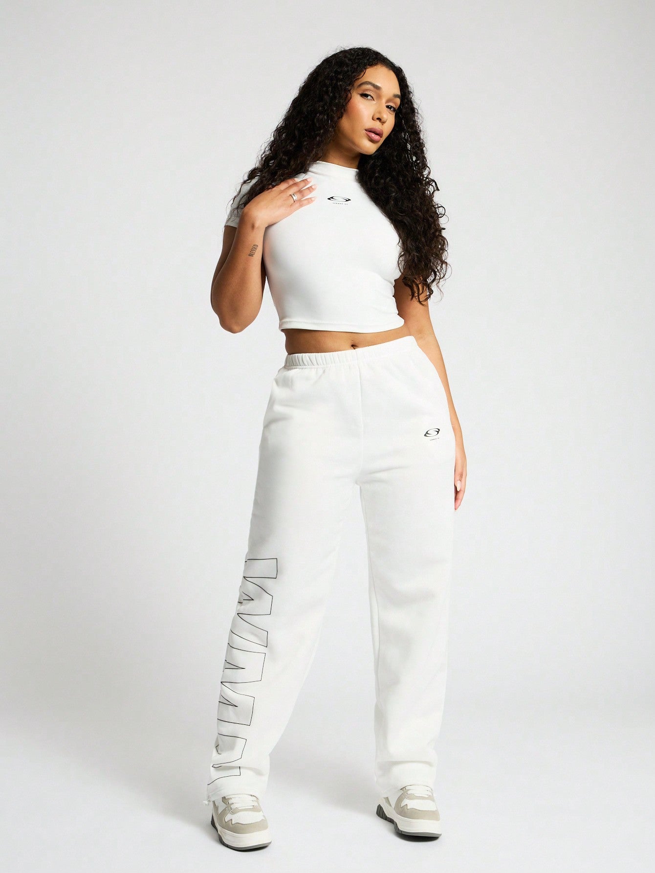 SUMWON WOMEN High Neck Crop Top And Straight Leg Jogger Co Ord With Graphic Print