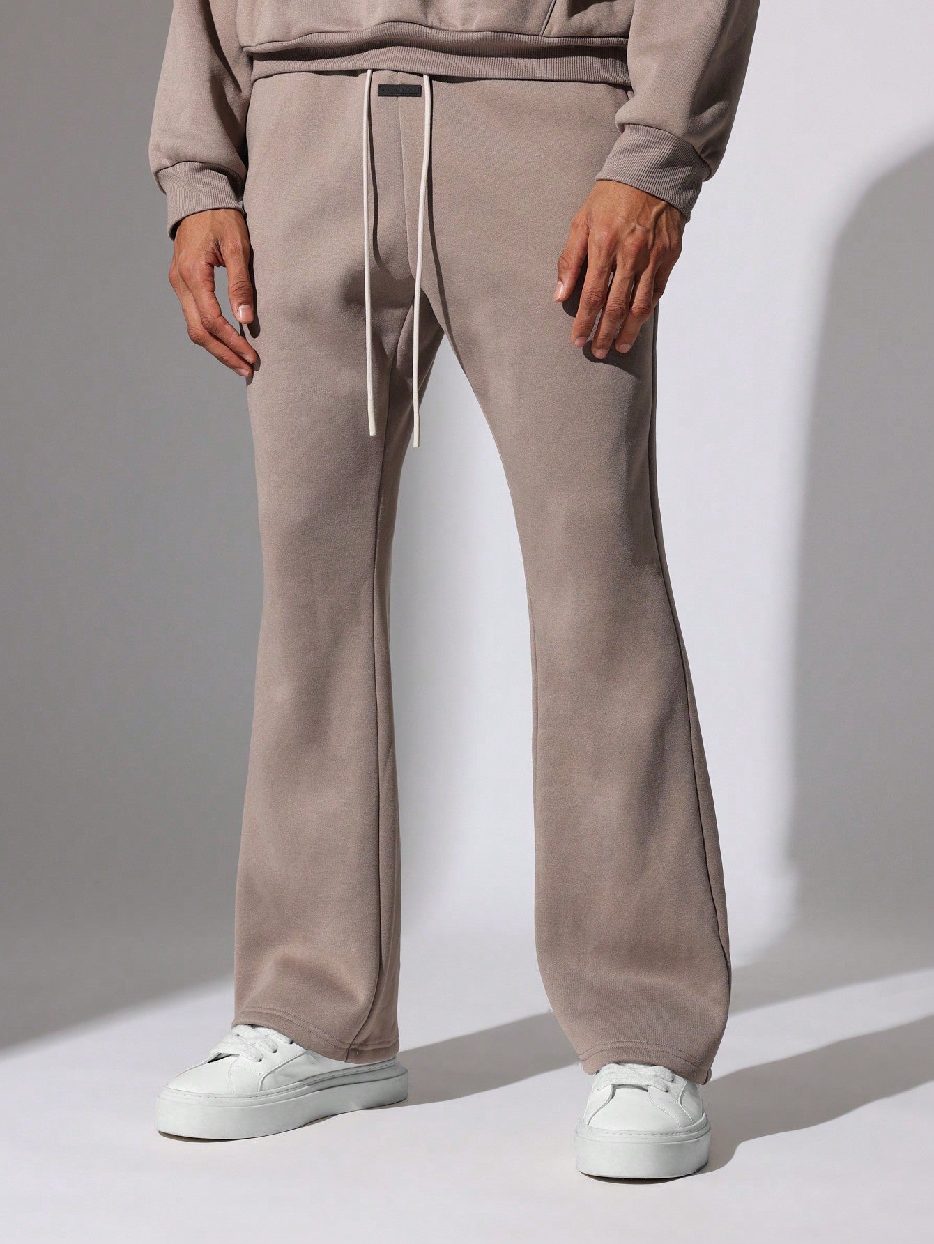 Regular Fit Overhead Hoodie And Flare Fit Sweatpants With Silicon Badge & Drawstrings 2 Piece Set