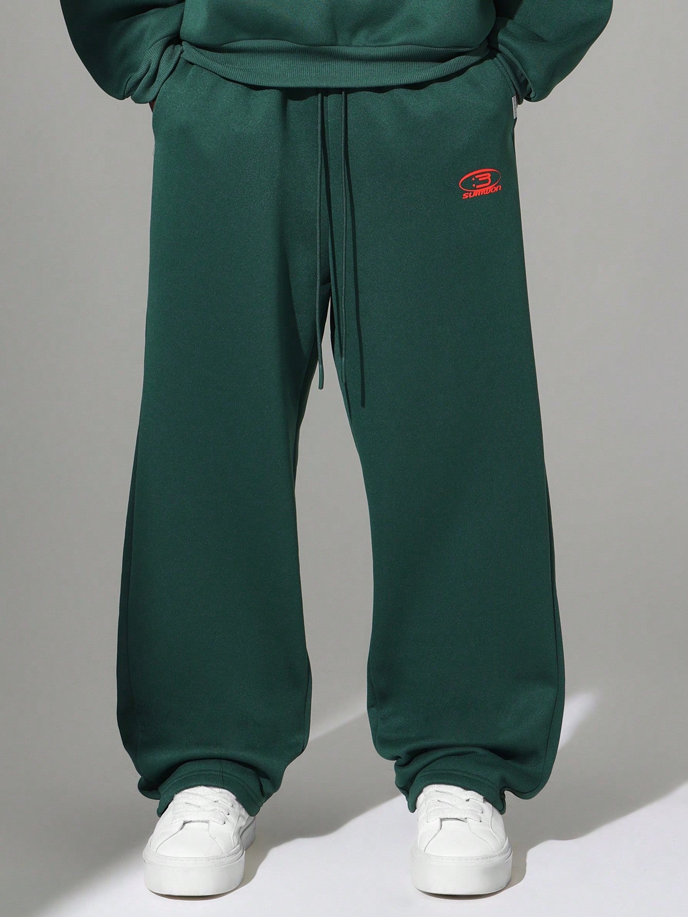 Regular Fit Overhead Hoodie With Kangaroo Pocket And Drop Crotch Sweatpants With Graphic Print 2 Piece Set